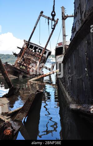 Abandoned boats in Rabaul Harbour, Papua New Guinea Stock Photo