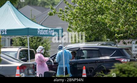 Berks County, Pennsylvania-May 15, 2020:  Patient being tested in her vehicle at Patient Frist drive-through coronavirus COVID-19 testing location. Stock Photo