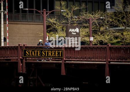 Chicago, USA. 15th May, 2020. Pedestrians wearing protective masks cross State Street Bridge on Friday May 15, 2020 in Chicago, IL. (Photo by Christopher Dilts/Sipa USA) Credit: Sipa USA/Alamy Live News Stock Photo