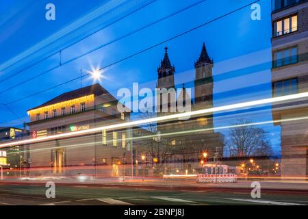 Germany, Saxony-Anhalt, Magdeburg, the Magdeburg Cathedral, in front of light trails of the tram, night shot Stock Photo
