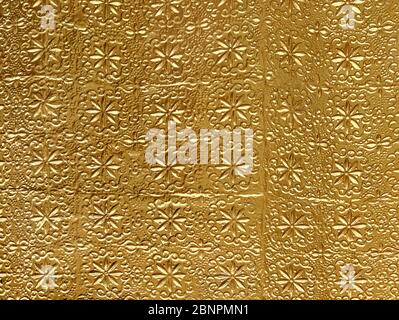 Golden metal ornament texture used as background. Stock Photo