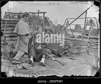 Scene showing deserted camp and wounded soldier. (Zouave)