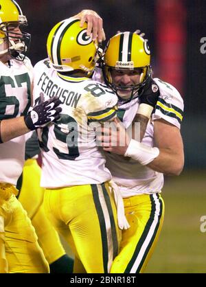 Green Bay Packers quarterback Brett Favre is congratulated by wide receiver  Robert Ferguson (89) and center Grey Ruegamer after second quarter  touchdown pass against the Oakland Raiders during 41-7 victory in a NFL  football game at Network