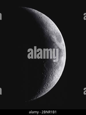 Dramatic crescent moon against a black sky, photographed from London, UK Stock Photo