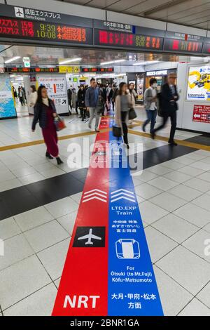 Japan, Honshu, Tokyo, Shinjuku, Shinjuku Train Station, Bi-lingual Coloured Direction Paths Shown on Station Floor Stock Photo