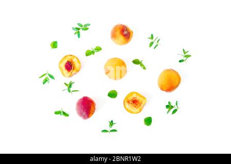 Ripe peaches with leaves isolated on white background. Summer fruit pattern. Top view. Flat lay Stock Photo