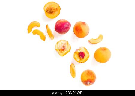 Tasty ripe peaches isolated on white background. Sweet summer fruits. Top view. Flat lay Stock Photo