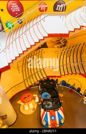 England, London, Leicester Square, Interior of M&M Store showing Colourful Staircases Stock Photo