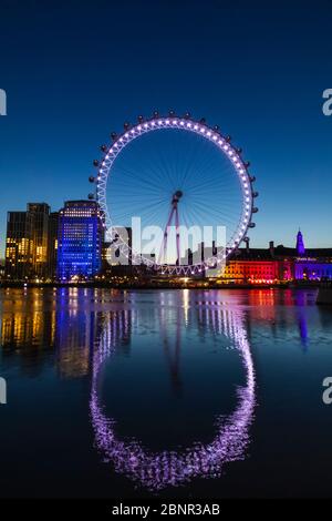 England, London, London Eye and County Hall Building at Night Stock Photo
