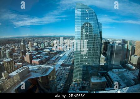 View of city with snow and mountains from Banker's Hall building, Calgary, Alberta, Canada Stock Photo