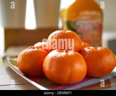 Fresh tangerines taken in natural light from the window Stock Photo