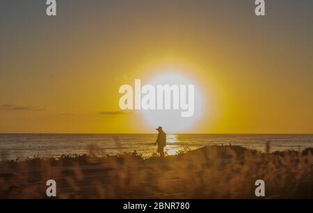 San Diego, USA. May 15, 2020: San Diegans enjoy Moonlight State Beach in Encinitas. Additional state beaches and small businesses reopened in San Diego, CA on May 15, 2020. (Credit Image: © Rishi DekaZUMA Wire) Credit: ZUMA Press, Inc./Alamy Live News Credit: ZUMA Press, Inc./Alamy Live News Stock Photo