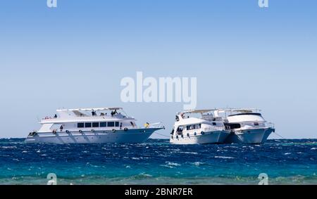 three white pleasure boat in the Red Sea in Egypt Dahab South Sinai ...