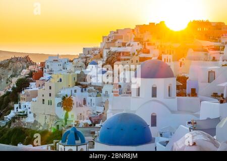 Greece. Oia town on Santorini island. Sunset over the roofs of buildings on the caldera Stock Photo