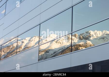 Nordkette Innsbruck in the reflection of a window front Stock Photo