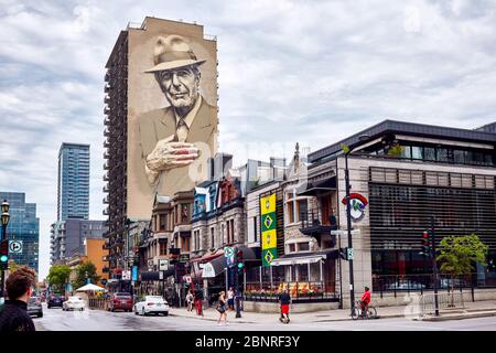 Montreal, Canada - June, 2018: Canadian singer Leonard Cohen mural or monument painted on a building on Crescent street in Montreal, Quebec, Canada. Stock Photo