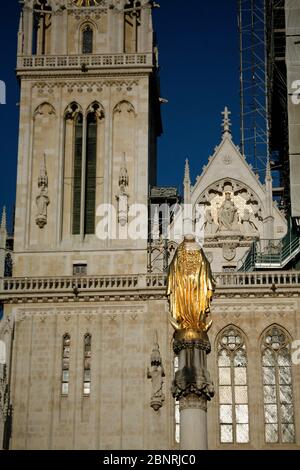 Golden Virgin Mary statue at Kaptol Square near St Stephen cathedral. Stock Photo