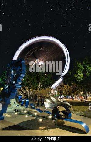 The Reef Eye ferris wheel ride attraction and the spectacular art work installation on the esplanade in Cairns, Queensland, Australia. Stock Photo