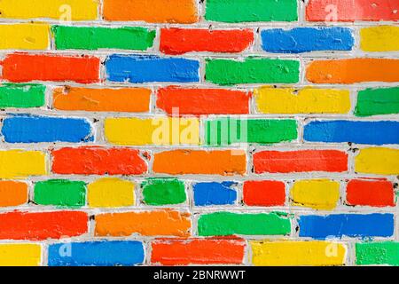 bright colorful multi-colored painted brick texture background, selective focus. Stock Photo