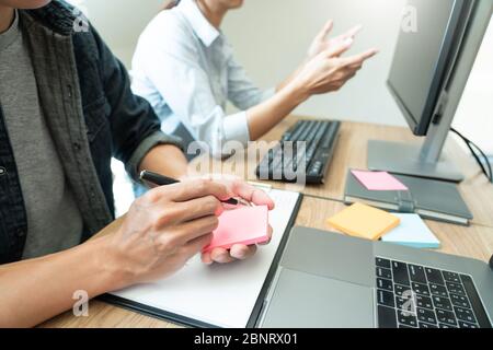 Collaborative work Software engineers website developer technologies or programmer working coding on startup ai application project on screen with par Stock Photo