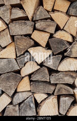 Precisely layered pile of wood from different cut firewood, heating material, sustainable reforestation Stock Photo