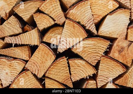 Precisely layered pile of wood from different cut firewood, heating material, sustainable reforestation Stock Photo