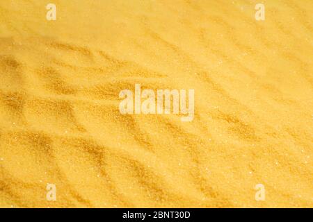 Yellow sand texture and background. Stock Photo