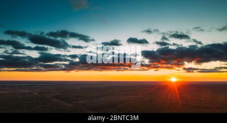 Aerial View Of Sunshine In Sunrise Bright Dramatic Sky. Scenic Colorful Sky At Dawn. Sunset Sky Above Autumn Forest Landscape In Evening. Top View Fro Stock Photo