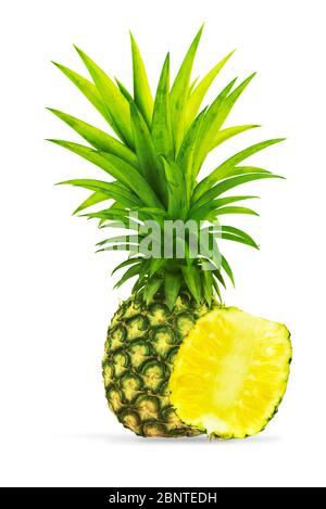 Whole pineapple with slice on clean white background Stock Photo