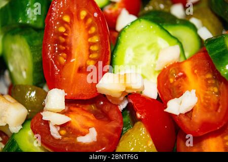 Vegetable salad sliced tomatoes, cucumbers, onions and pickles. Close up. Healthy food, fitness diet Stock Photo
