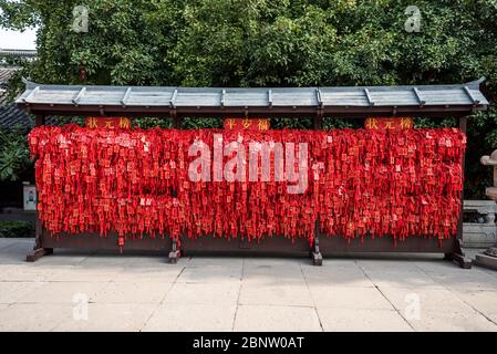 Red lucky charms hanging in Confucius temple in Nanjing City, Jiangsu Province, China, a temple for the veneration of Confucius and the sages and phil Stock Photo