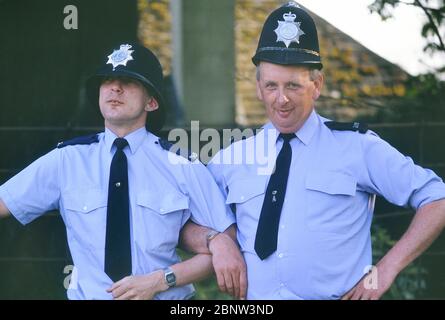 Two male police constables posing for a 