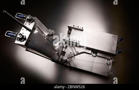 Top view of a injection molding die on studio background Stock Photo