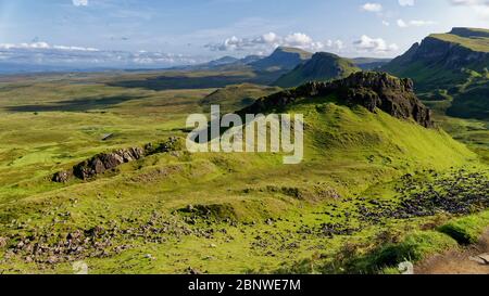 View south from The Quiraing trail, Trotternish Ridge, Isle of Skye, Scotland, UK  Cnoc a' Mheirlich (266M near right) with Cleat (336M behind) Stock Photo