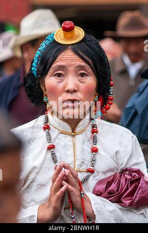 Tibetan girls in traditional dress by the Potala palace. Lhasa, Tibet