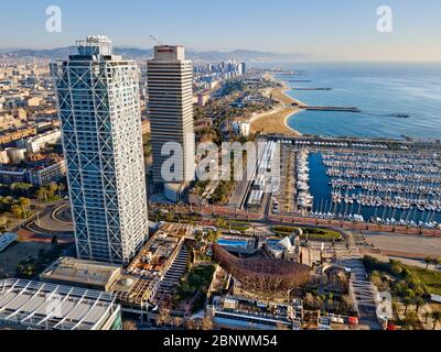 Twins towers Mapfre tower and Hotel Arts and port aerial view Barcelona Catalonia Spain.  The twin towers on the skyline of Barcelona are the Torre Ma Stock Photo