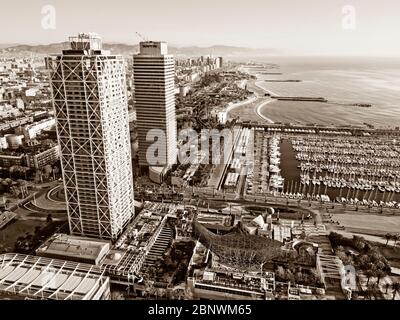 Twins towers Mapfre tower and Hotel Arts and port aerial view Barcelona Catalonia Spain.  The twin towers on the skyline of Barcelona are the Torre Ma Stock Photo