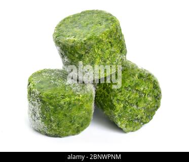 Frozen Spinach leaves. Isolated on white background Stock Photo