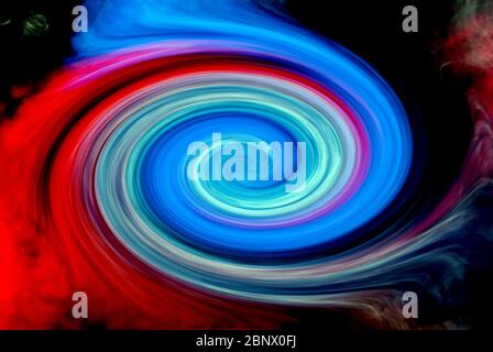 blue and red smoke twisted into a spiral for the background Stock Photo