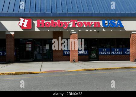 A logo sign outside of a HobbyTown USA retail store location in Newport News, Virginia on May 2, 2020. Stock Photo