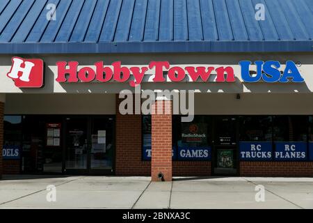 A logo sign outside of a HobbyTown USA retail store location in Newport News, Virginia on May 2, 2020. Stock Photo