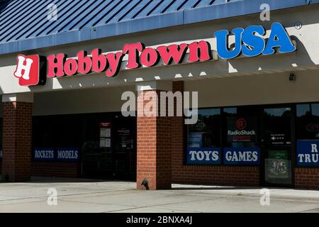 A logo sign outside of a HobbyTown USA retail store location in Newport News, Virginia on May 2, 2020. Stock Photo