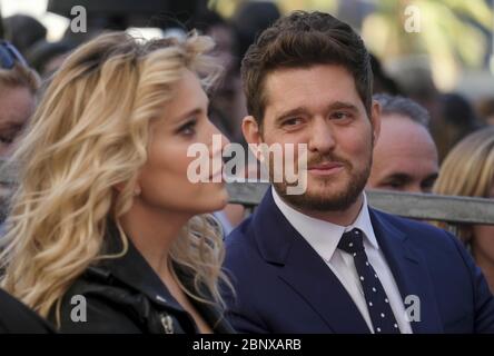 May 16, 2020: FILE: Michael Buble's family is still being affected by a viral social media video. Back in April, some critics raised concerns about the 'Haven't Met You Yet' singer's behavior towards his wife Luisana Lopilato in an Instagram Live. And this week, Luisana appeared on the Argentinian talk show Intrusos where she discussed how the controversy affected her family. As it turns out, Michael received death threats over the ordeal. PICTURED: November 16, 2018 - Los Angeles, California, U.S - Singer Michael Buble and his wife Luisana Lopilato attends his star ceremony on the Hollywood W Stock Photo