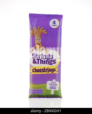 A packet of Cheestrings ( 4 pack) isolated on a white background Stock Photo
