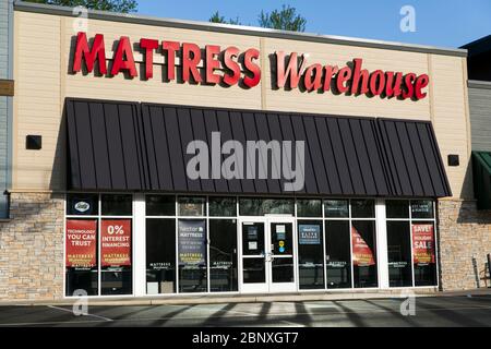 A logo sign outside of a Mattress Warehouse retail store location in Wilmington, Delaware on May 4, 2020. Stock Photo