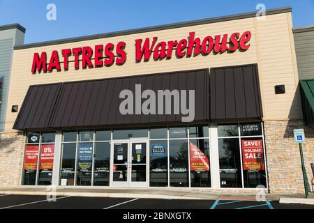 A logo sign outside of a Mattress Warehouse retail store location in Wilmington, Delaware on May 4, 2020. Stock Photo