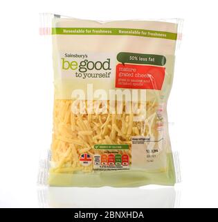 Sainsburys be good to yourself range mature grated cheese packet isolated on a white background. Stock Photo