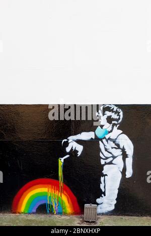 Rainbow boy, a 'Banksy' style stencil piece of street art on a