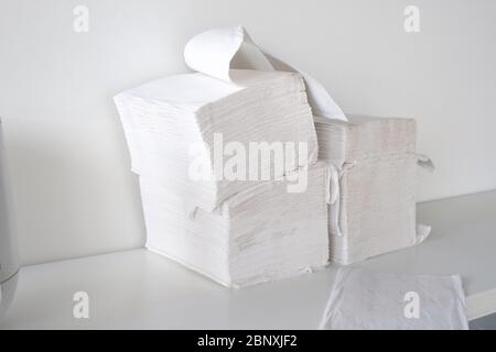 Pack of white napkins for hygiene on shelf. Close up Stock Photo