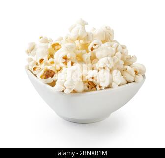 Salted popcorn in white bowl, isolated on white background